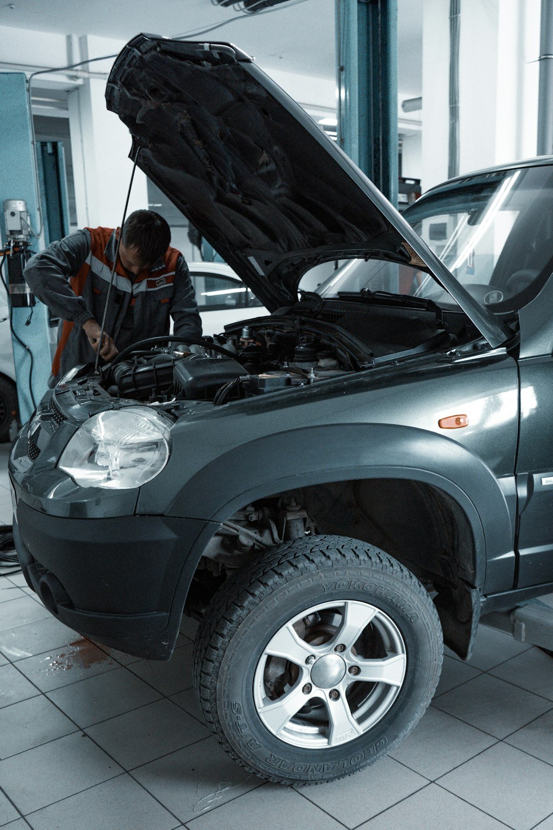 Services man-in-black-jacket-standing-beside-black-car-s5aygqn8ny8
